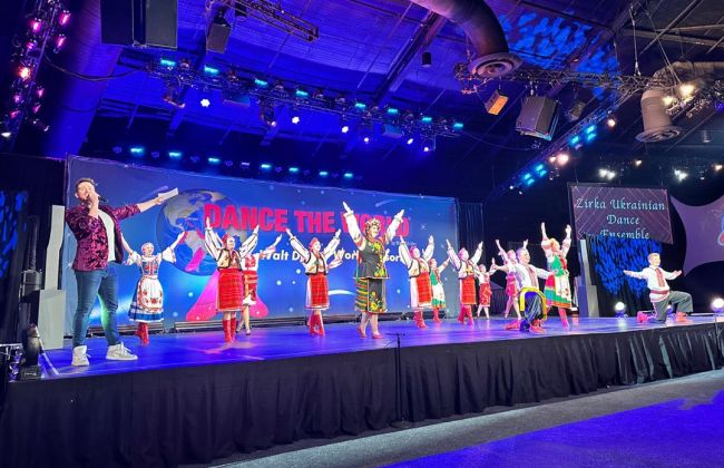 The Zirka Ukrainian Dance Ensemble dances on a stage.
